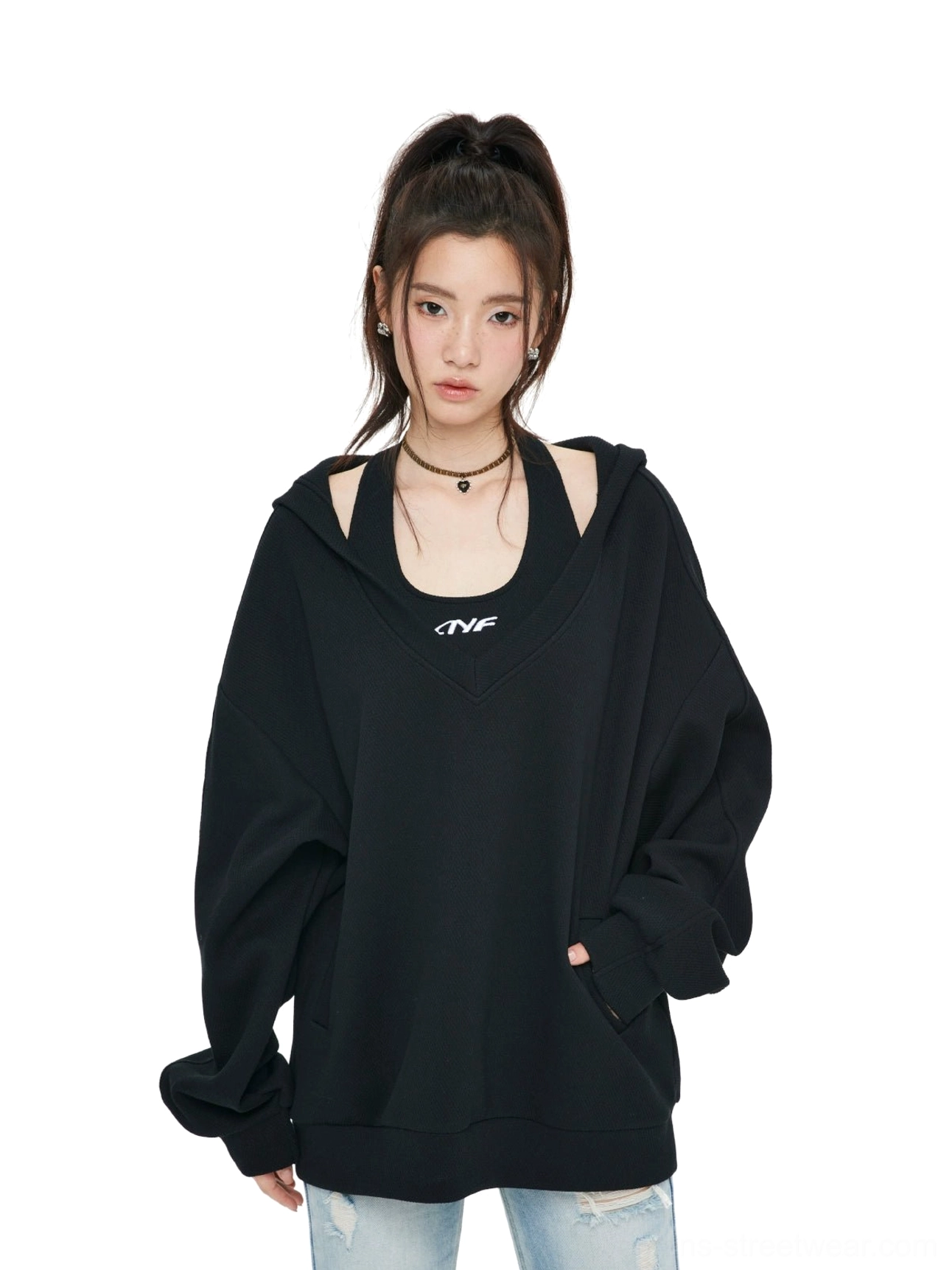 Black oversized V-neck hoodie sweatshirt with layered inner top, relaxed drop shoulder silhouette, and casual urban streetwear styling