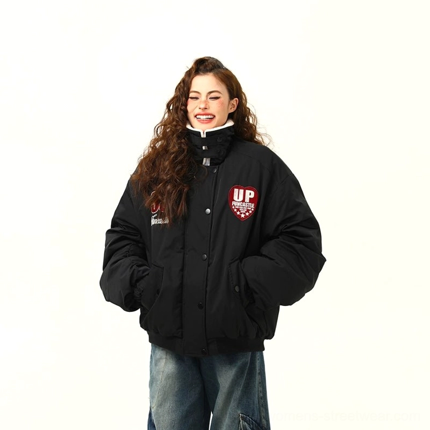 Black oversized varsity patch bomber jacket with contrast fleece collar and collegiate embroidery