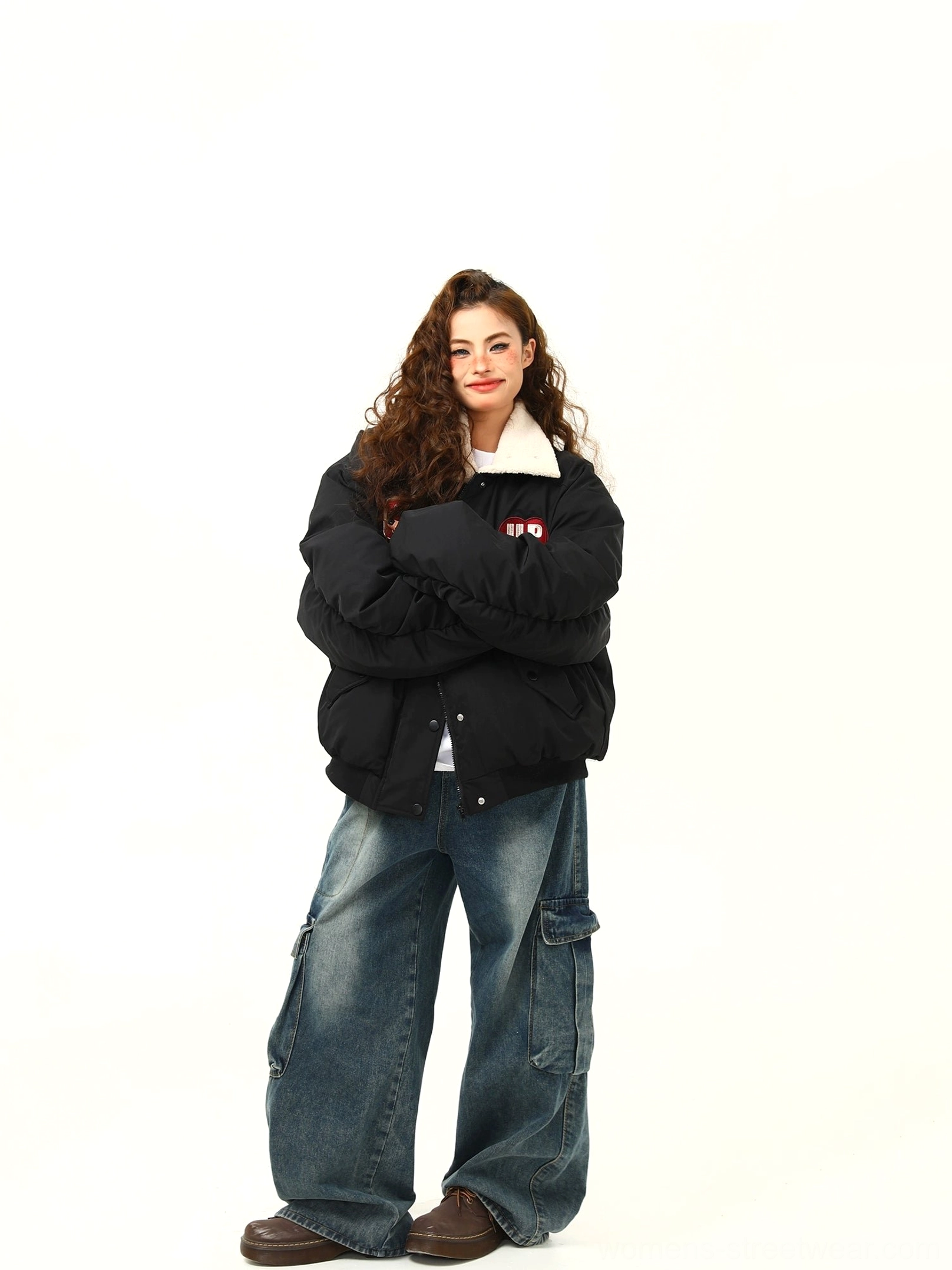 Black oversized varsity patch bomber jacket with fleece collar in a relaxed urban streetwear look