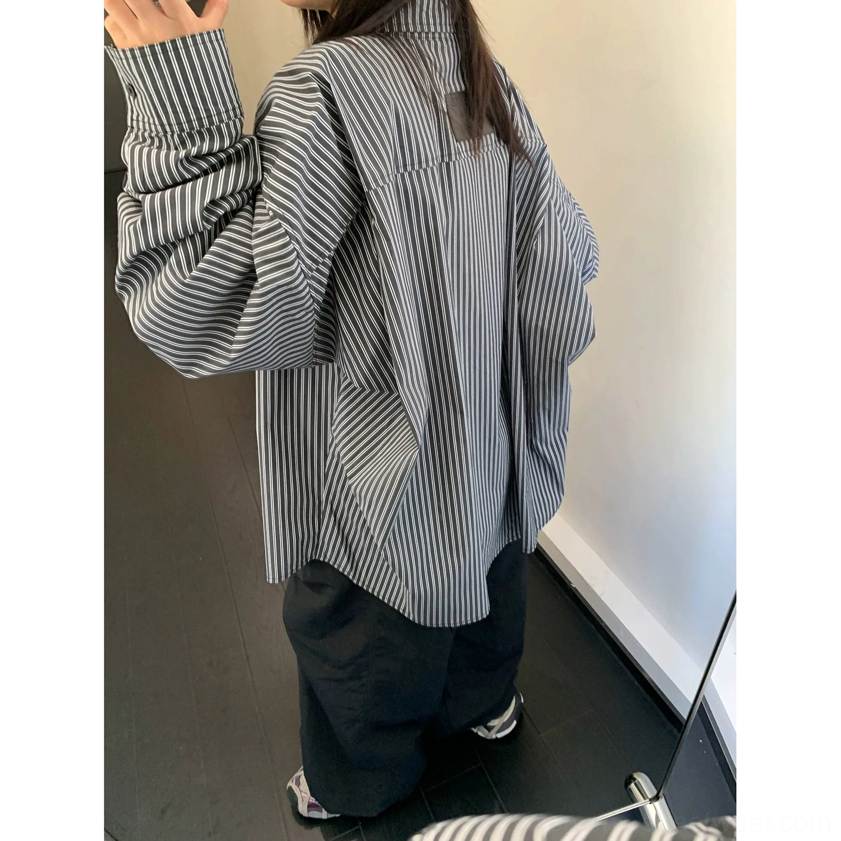 Oversized black striped button-up shirt with classic collar and breathable cotton streetwear construction