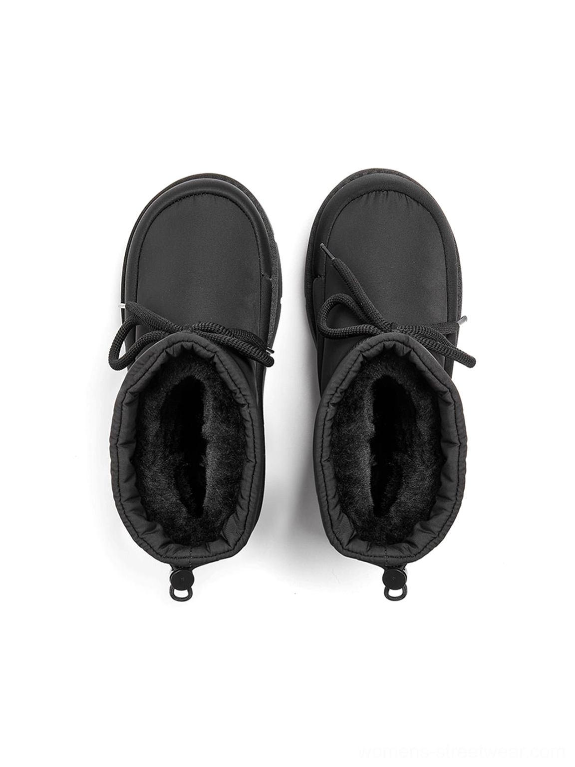 Top view of black padded platform snow boots showing soft fuzzy plush lining, flat wrap laces, and padded ankle opening