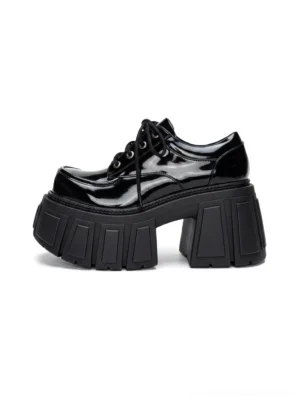 Black patent chunky platform derby heels with glossy lace-up Oxford upper, rounded toe, split platform, and grooved lug sole