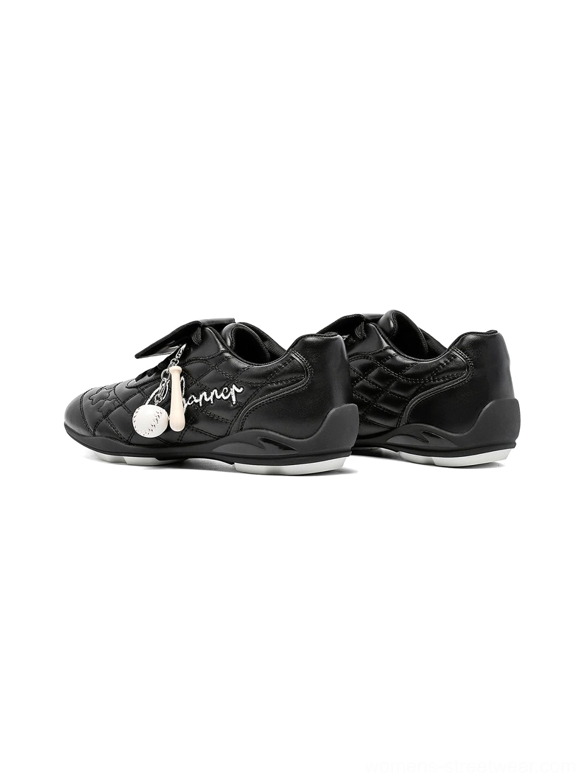 Black patent foldover tongue retro streetwear sneakers glossy upper and oversized tongue detail