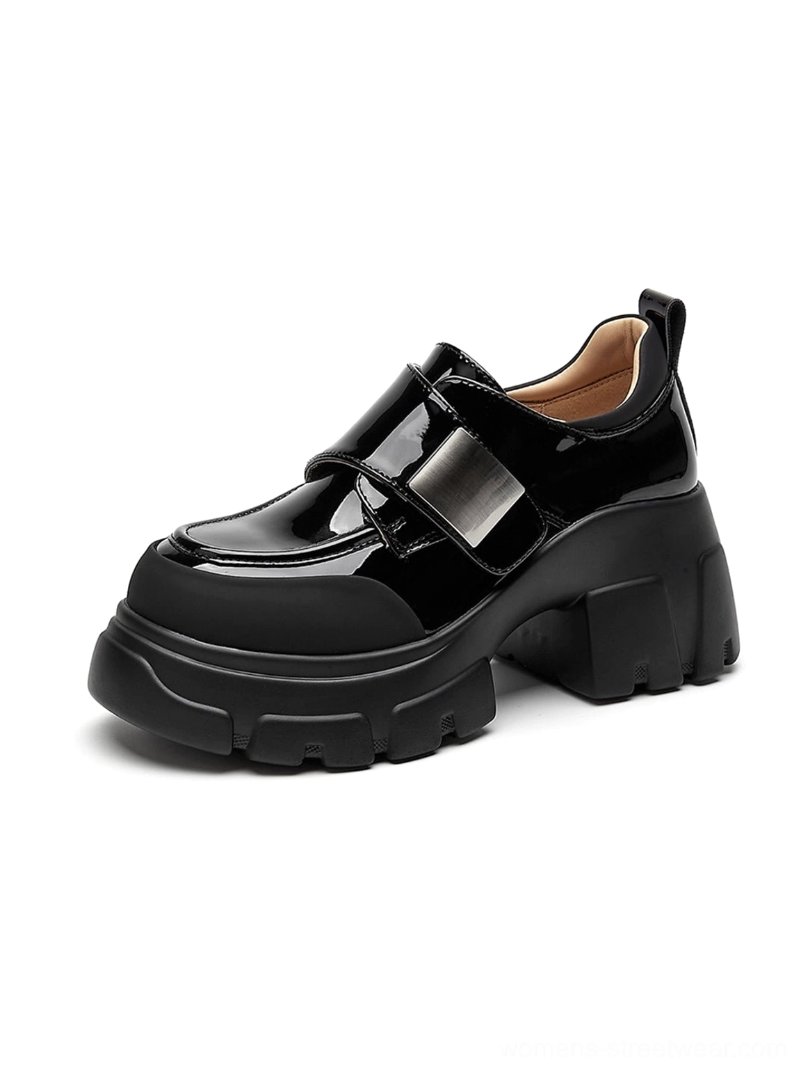 Side three-quarter view of black patent platform Mary Jane shoes showing chunky sole, rounded toe, and strap