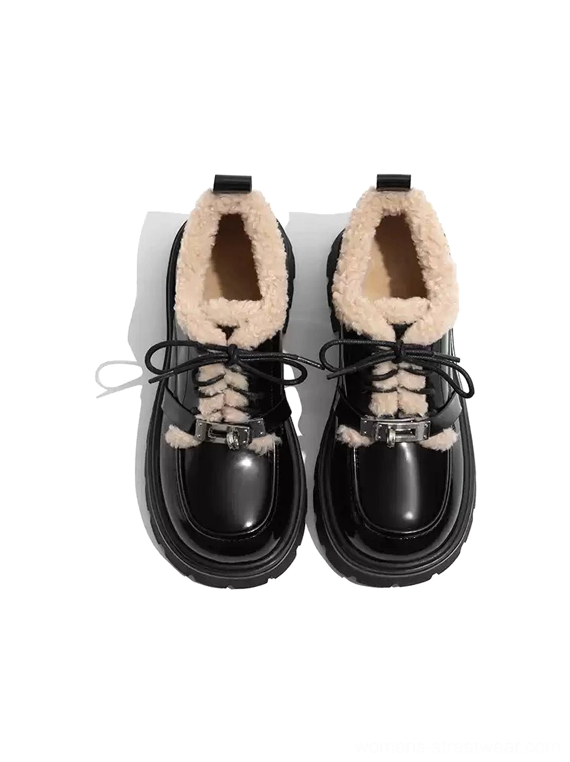 Front view of a pair of black patent platform Oxford shoes with beige fleece collars and decorative metal lace buckles