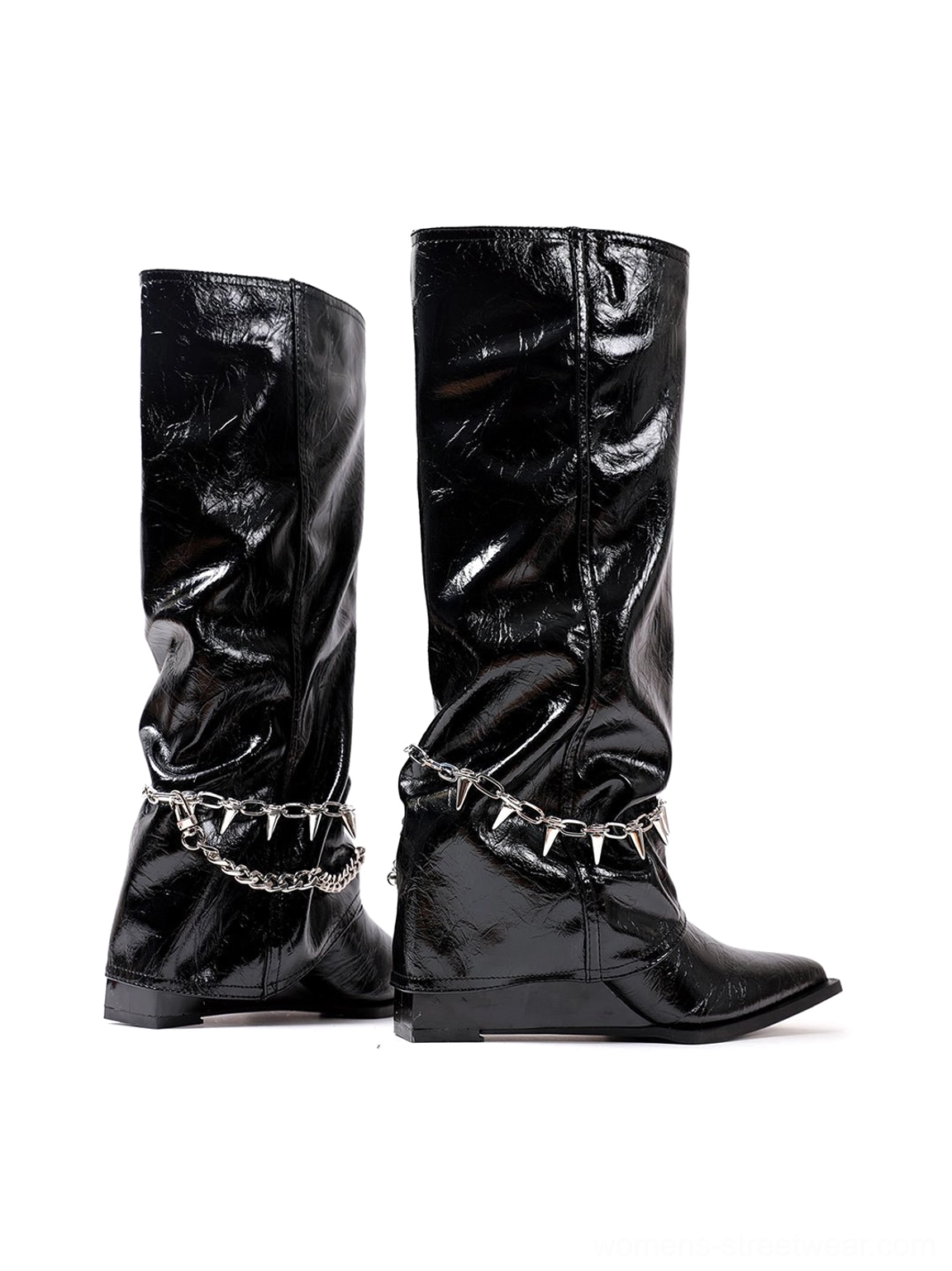 Back three-quarter view of black patent spiked chain mid-calf punk wedge boots with softly gathered shafts