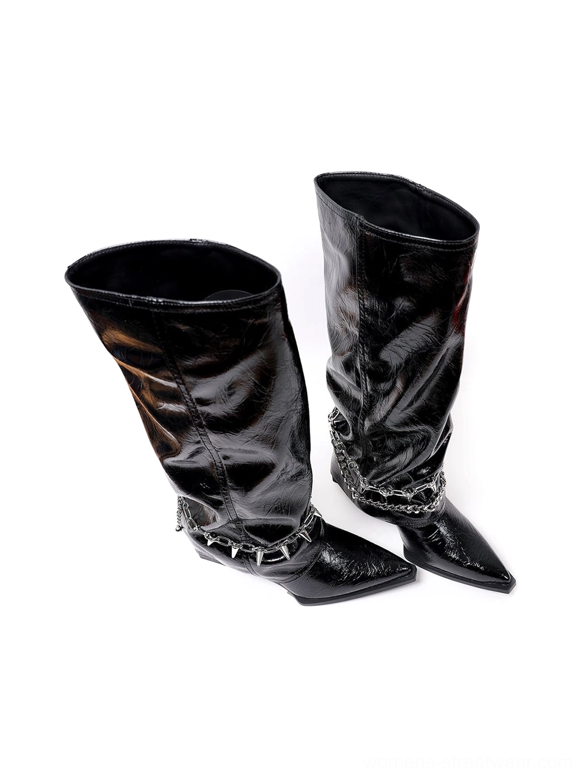 Rear side view of black patent spiked chain mid-calf punk wedge boots showing glossy slouchy boot shafts