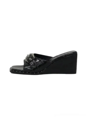 Black patent square-toe wedge slide sandals with glossy buckle-detail upper and studded platform sole edge side product view
