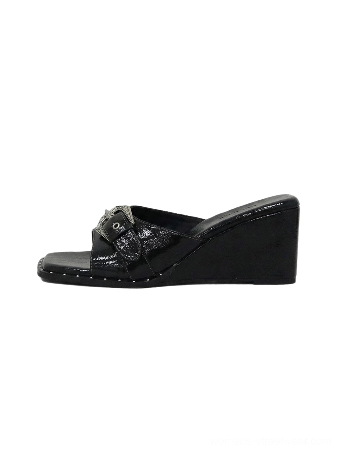 Black patent square-toe wedge slide sandals with glossy buckle-detail upper and studded platform sole edge side product view