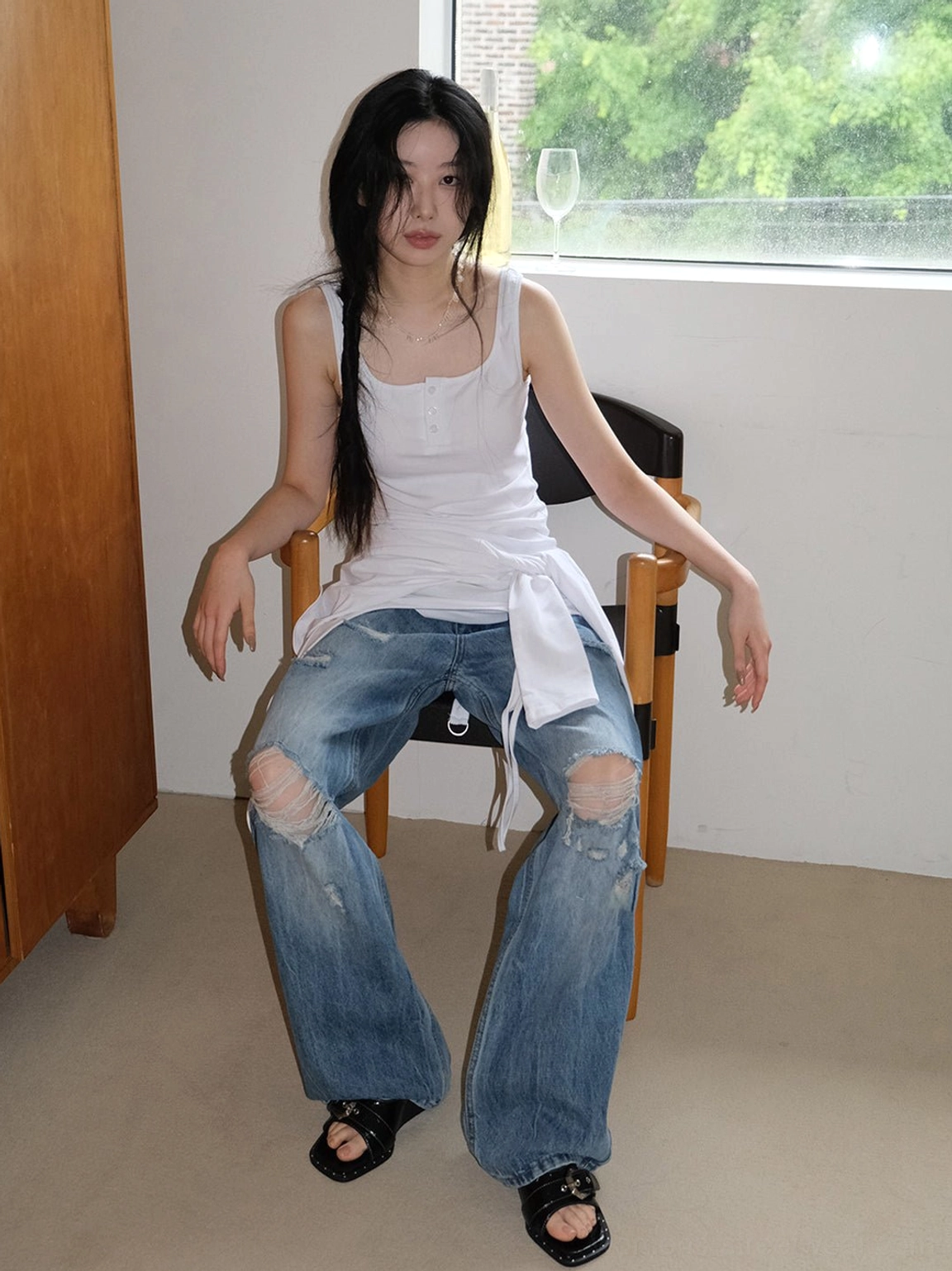 Black patent square-toe wedge slide sandals in relaxed everyday Y2K streetwear outfit with white tank top and jeans