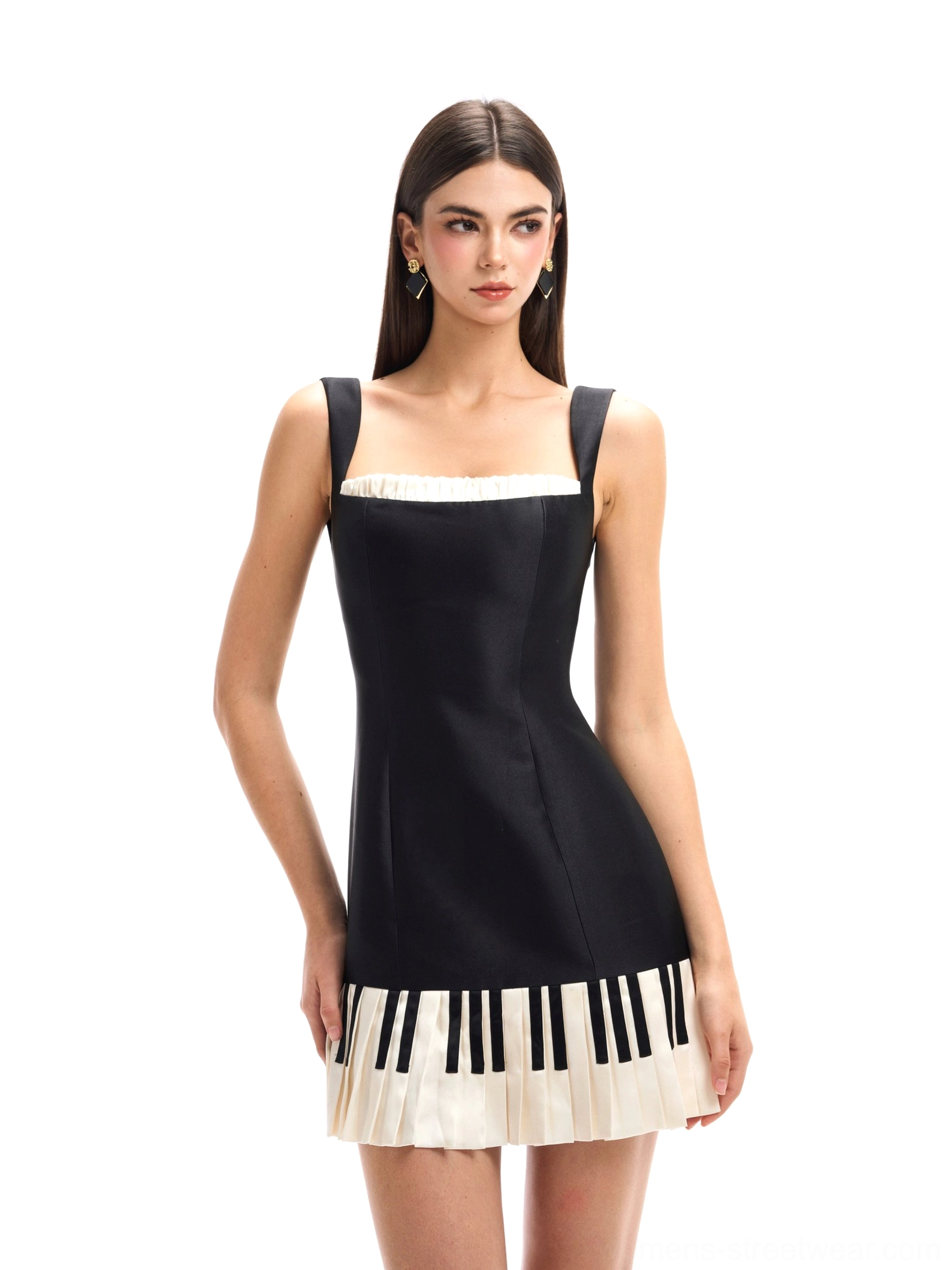 Angled front view of black piano keys mini dress with wide shoulder straps tailored slim silhouette and matching graphic pleated hem