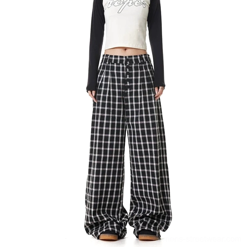 Black plaid high-waisted wide-leg streetwear pants shown from the front with button placket and relaxed oversized fit