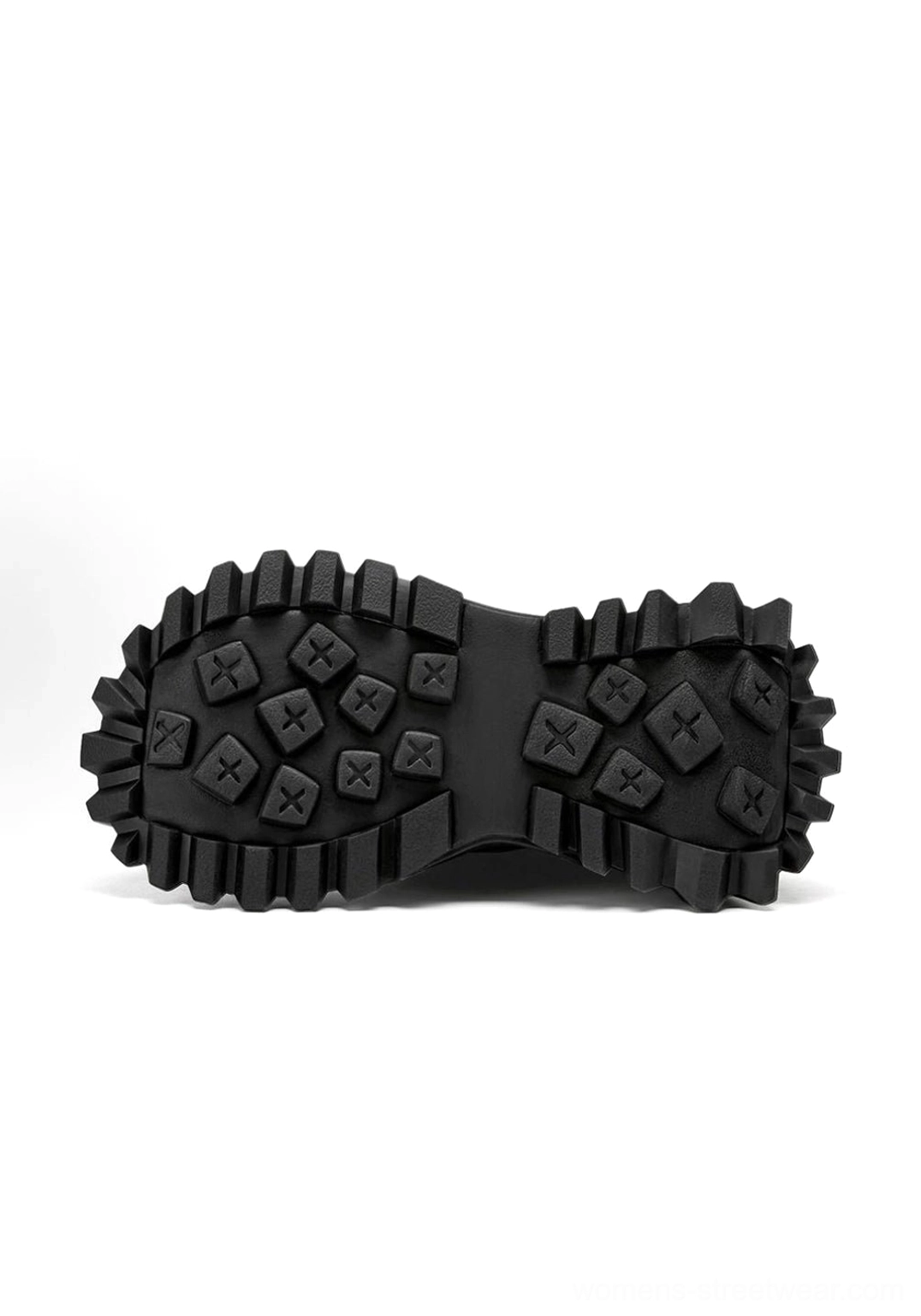 Top-down view of black combat boot outsoles with thick platform edges rugged anti-slip cross and square studs and deep tread pattern