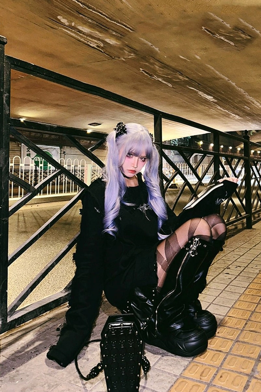 Alternative Seoul-inspired streetwear look with black platform footwear, fishnet stockings, and dark Y2K punk styling