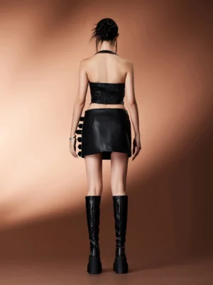 Black platform knee-high stretch boots worn with a streetwear outfit showing the close-fitting calf shaft from the back