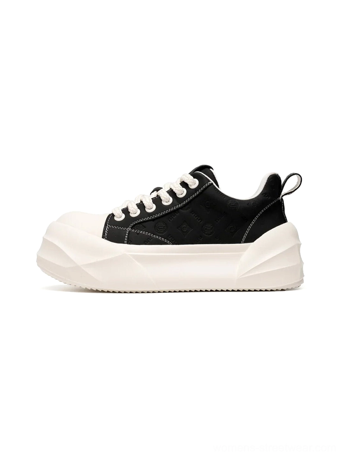 Black platform skate sneakers with geometric white sole shown in side front studio view