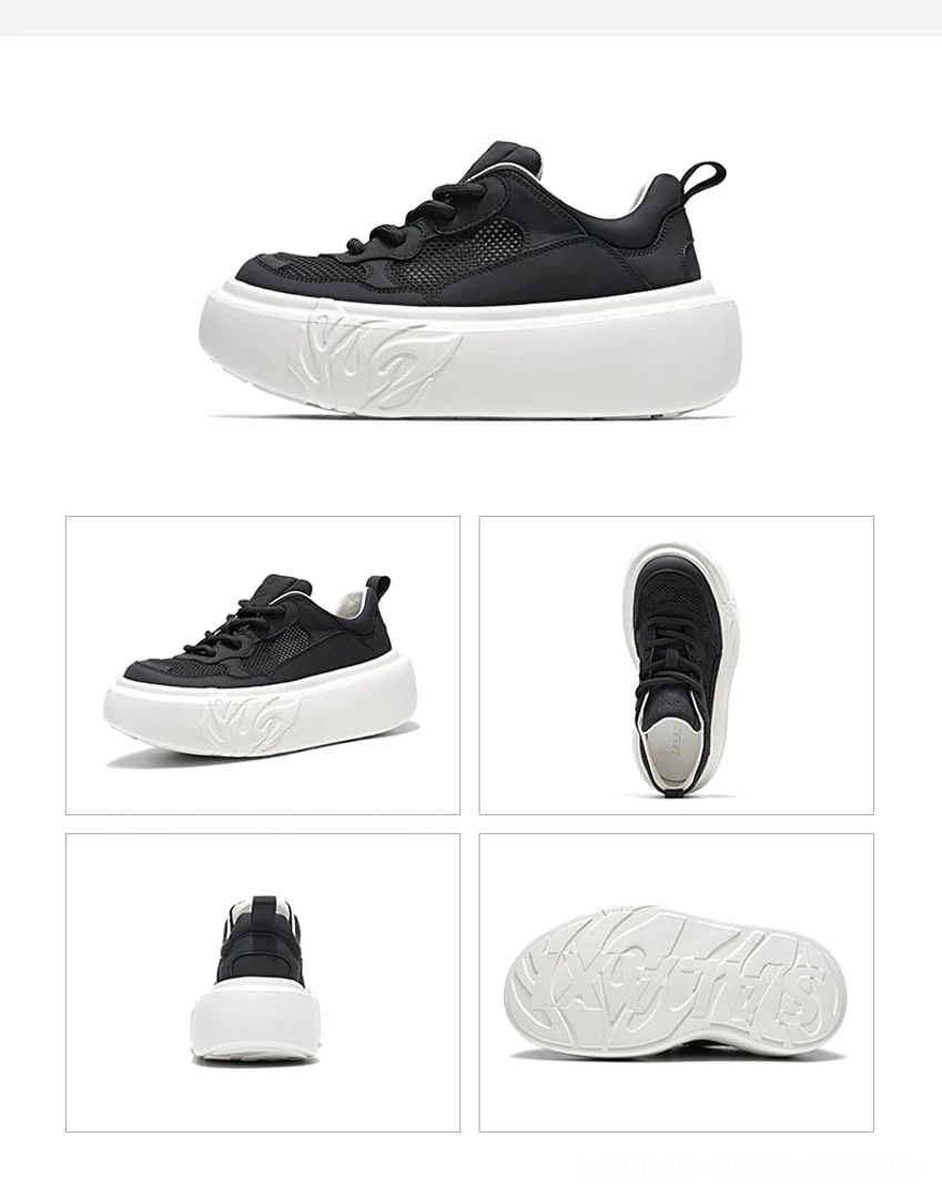 Black platform sneakers display with mesh and leather-look upper, contrasting white chunky outsole, and flame embossed detailing