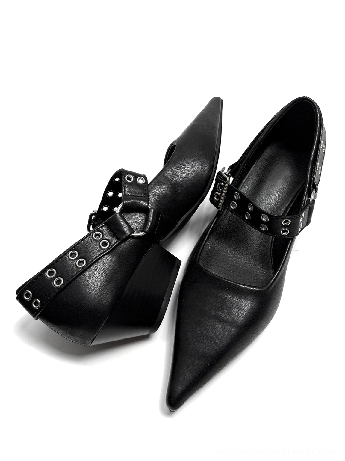 Black pointed Mary Jane pumps featuring smooth leather-look finish, wide ankle strap, metal eyelets, and low heel