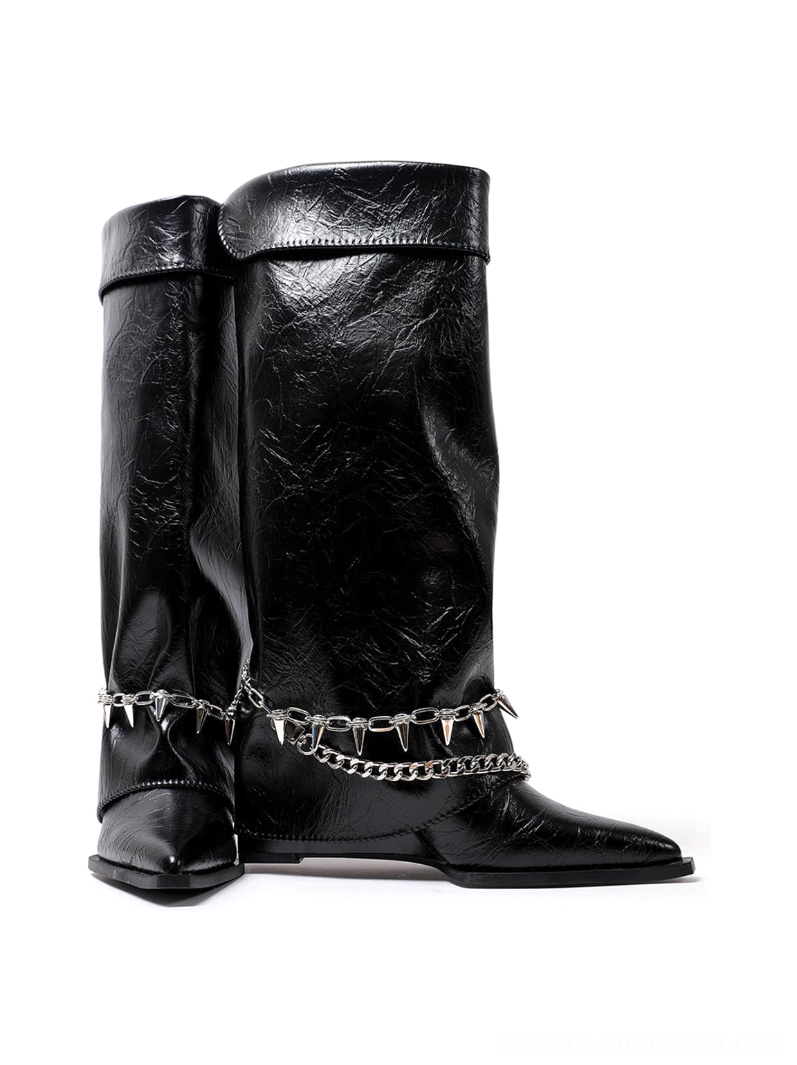 Pair of black pointed-toe chain riding boots with fold-over collars, metal button accents, layered spike chains, and textured crinkled finish