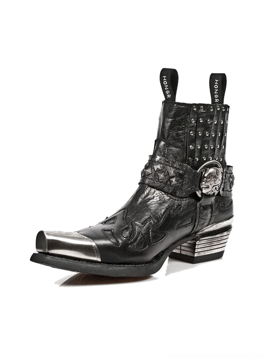 Side profile of a black pointed-toe western Chelsea boot with skull buckle strap studded collar silver toe cap and block heel
