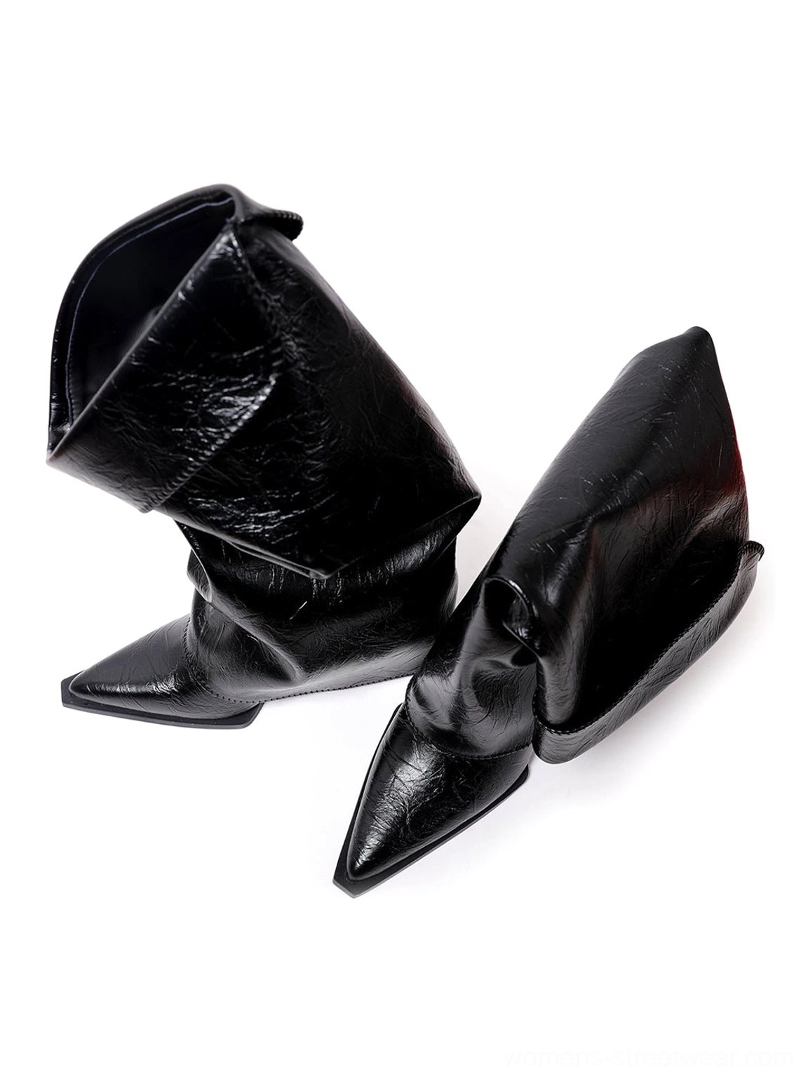 Black pointed-toe riding boots with layered spike chain accents, textured shaft, fold-over collar, and contemporary alternative streetwear styling