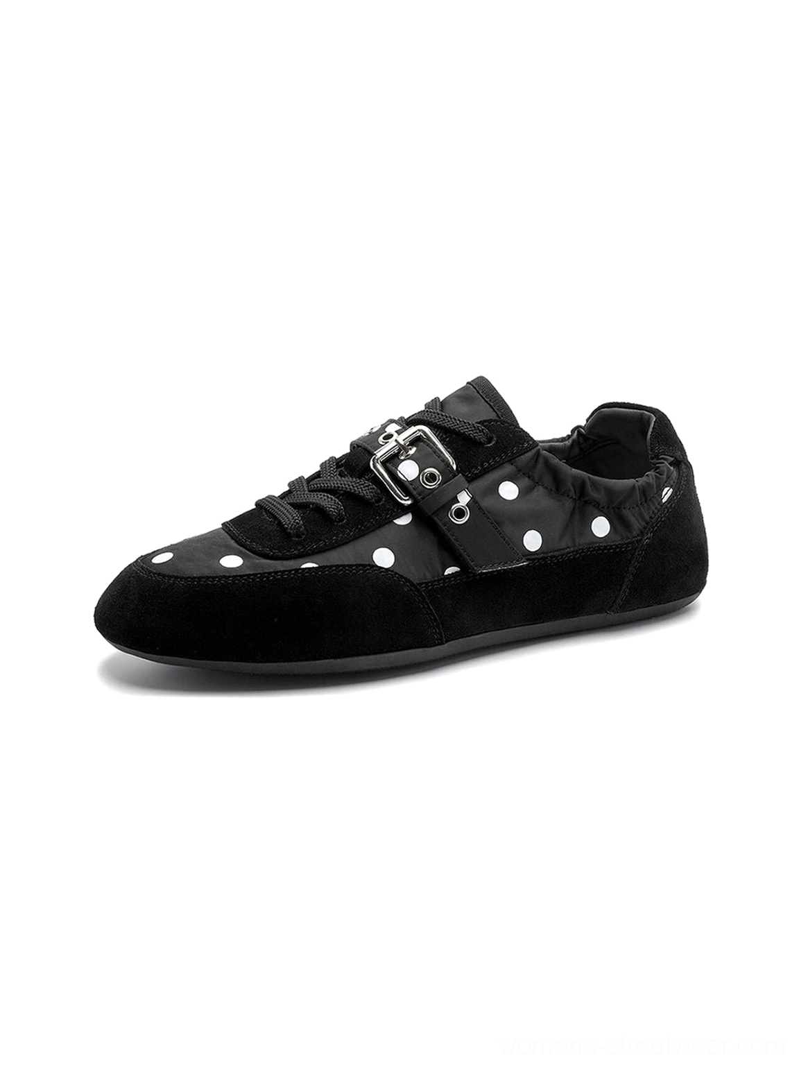 Detailed side product view of black polka dot ballet sneakers with white dots, silver buckle strap, and sleek flat sole
