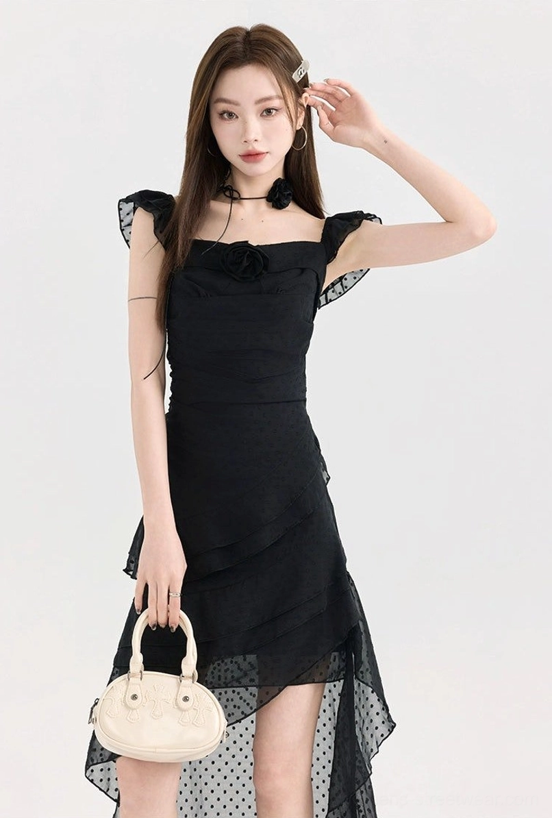 Black polka dot mesh ruffle high-low dress featuring a square neckline, floral chest ornament, layered ruffles, and sheer tulle train