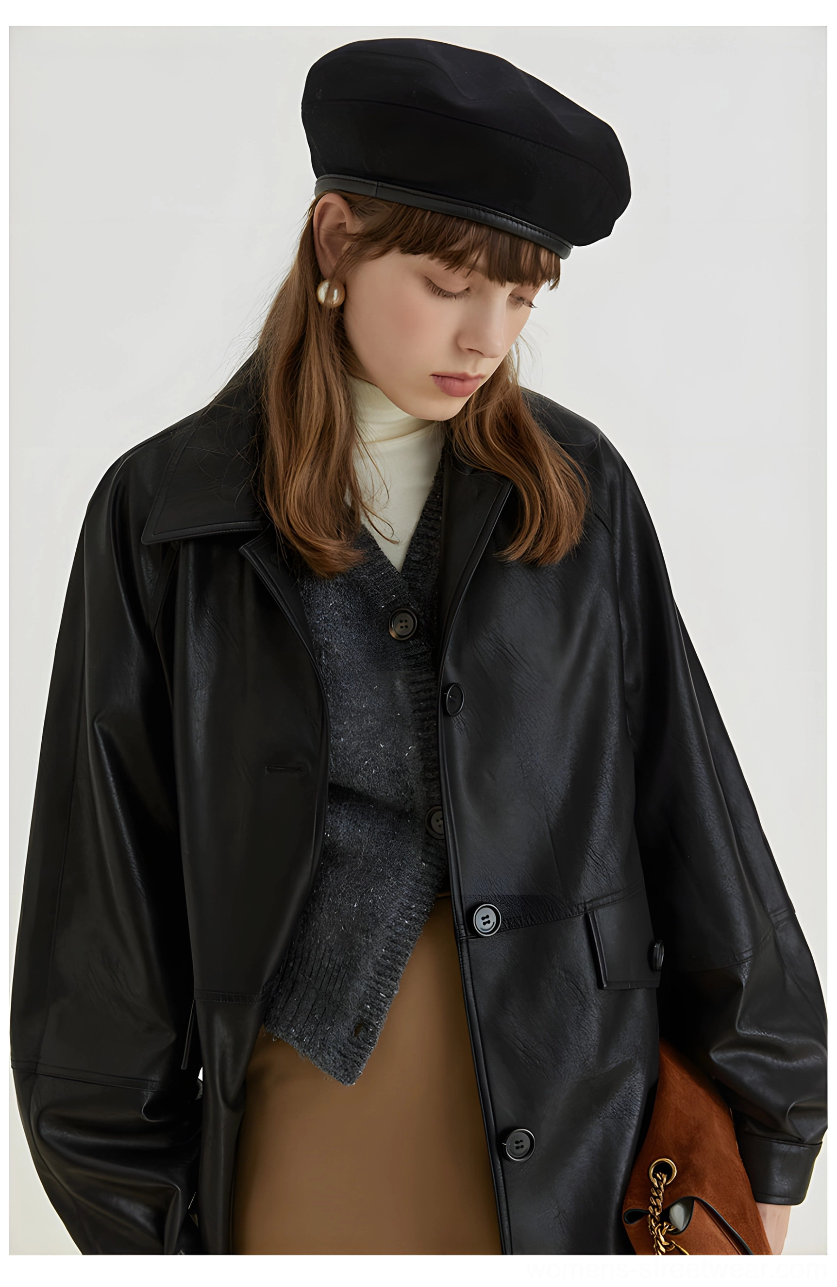 Front medium view highlighting the relaxed long sleeves button placket and straight hem of the black PU leather moto jacket