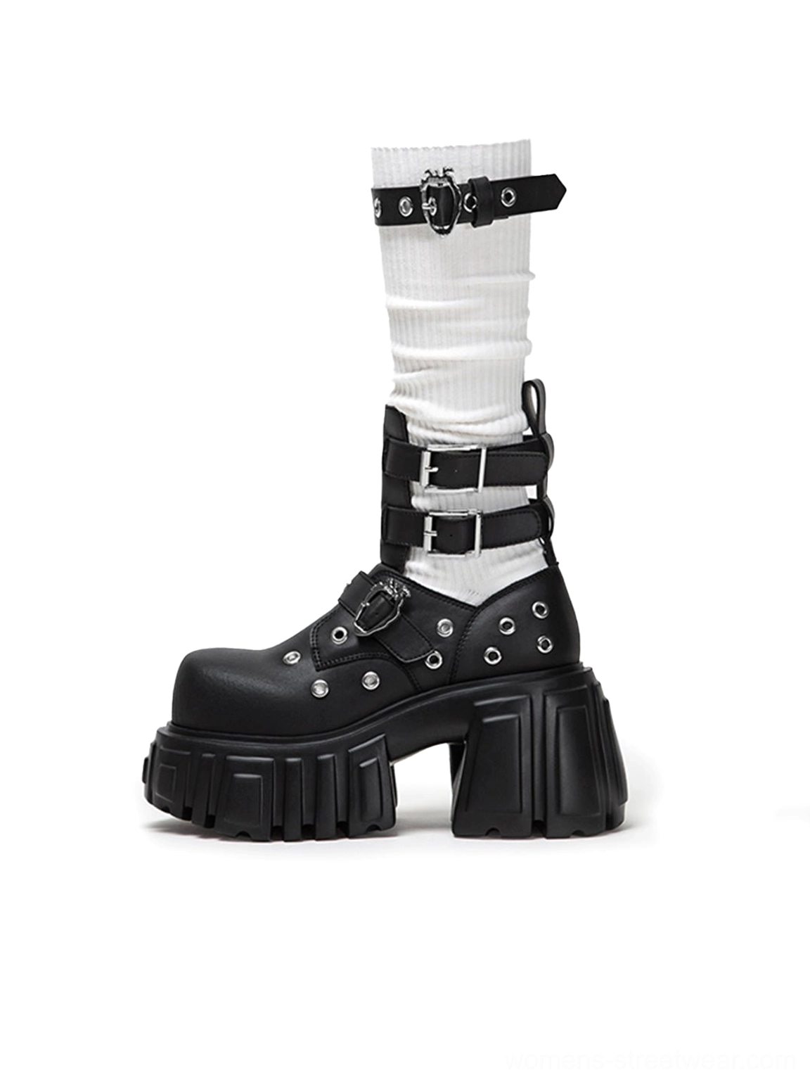 Side view of a model wearing black punk platform ankle boots with white ribbed socks ankle buckle details and chunky soles