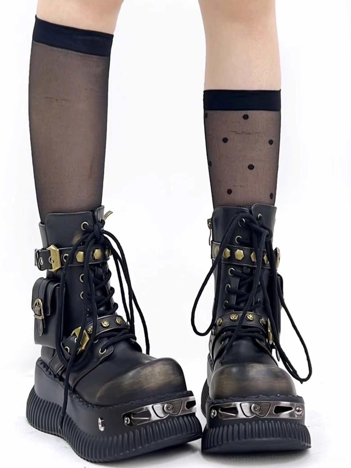 Black punk platform ankle boots worn with sheer polka dot stockings, buckle straps, ankle pocket details, and alternative streetwear styling