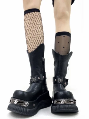 Black punk platform boots styled with fishnet and sheer polka dot thigh high socks, spider buckle straps, metal toe hardware, and chunky soles