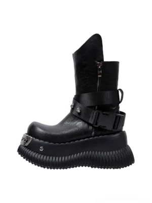 Black punk platform mid-calf boots with spider buckle straps, pointed toe, metal hardware, side zipper, and chunky ridged platform sole on a white background