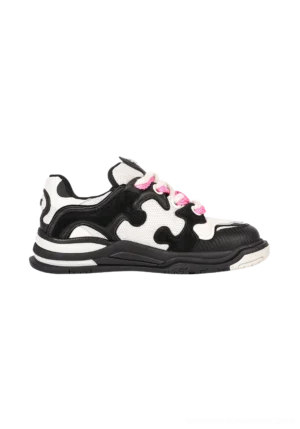 Side profile of black and off-white puzzle panel suede skate sneaker with hot pink laces layered upper and thick rubber outsole