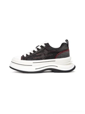 Black red layered canvas platform sneakers shown in left side profile with dark upper, white toe cap, thick 7cm elevated sole, grid heel trim, and red contrast stitching