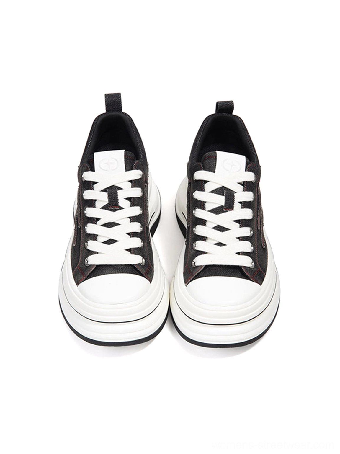 Front view of black red layered platform canvas sneakers with symmetrical white laces, white toe caps, round toes, and thick elevated soles