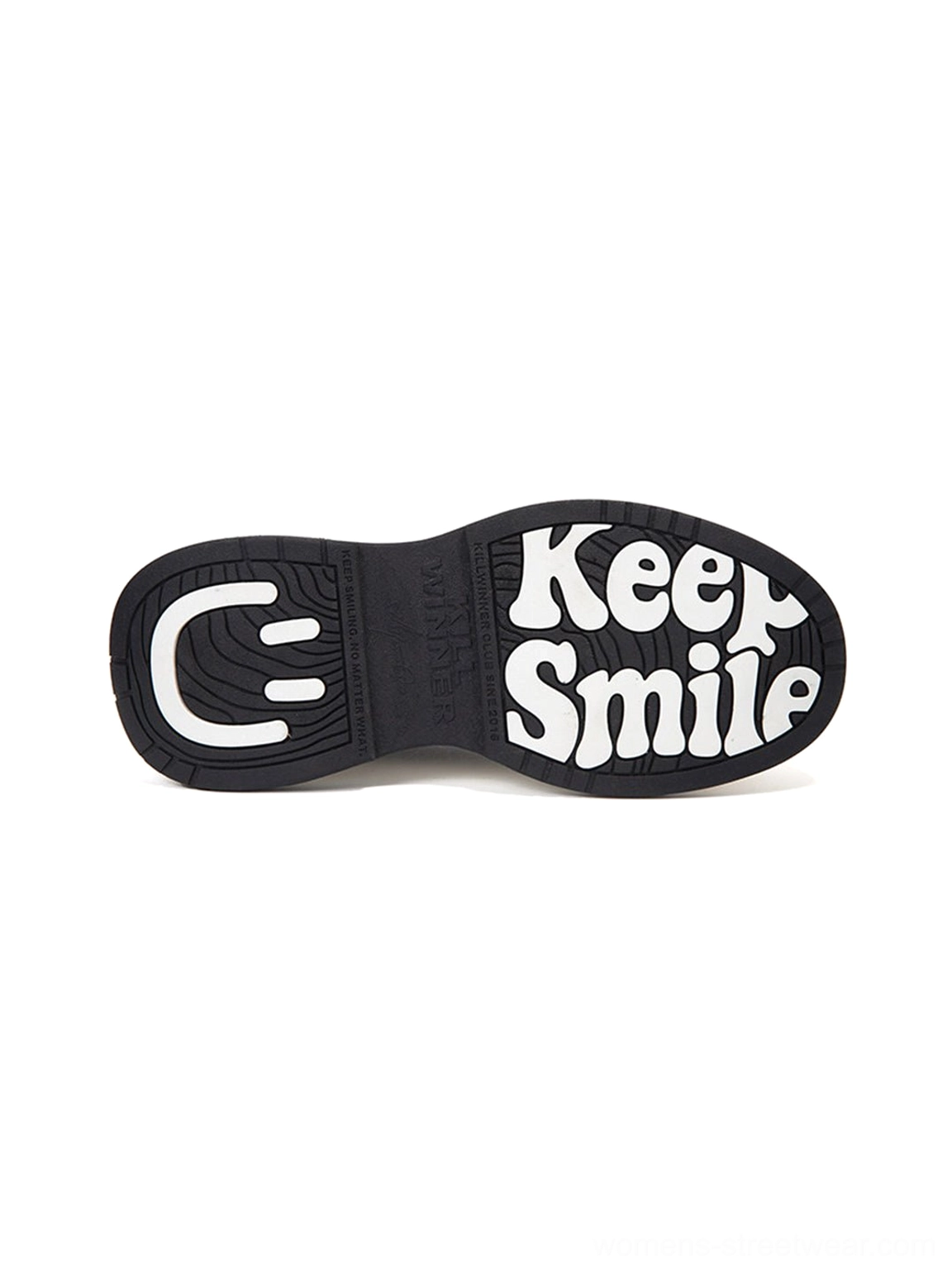 Close up of black rubber outsole on black red platform sneakers with Keep Smile text and smiling face graphic print