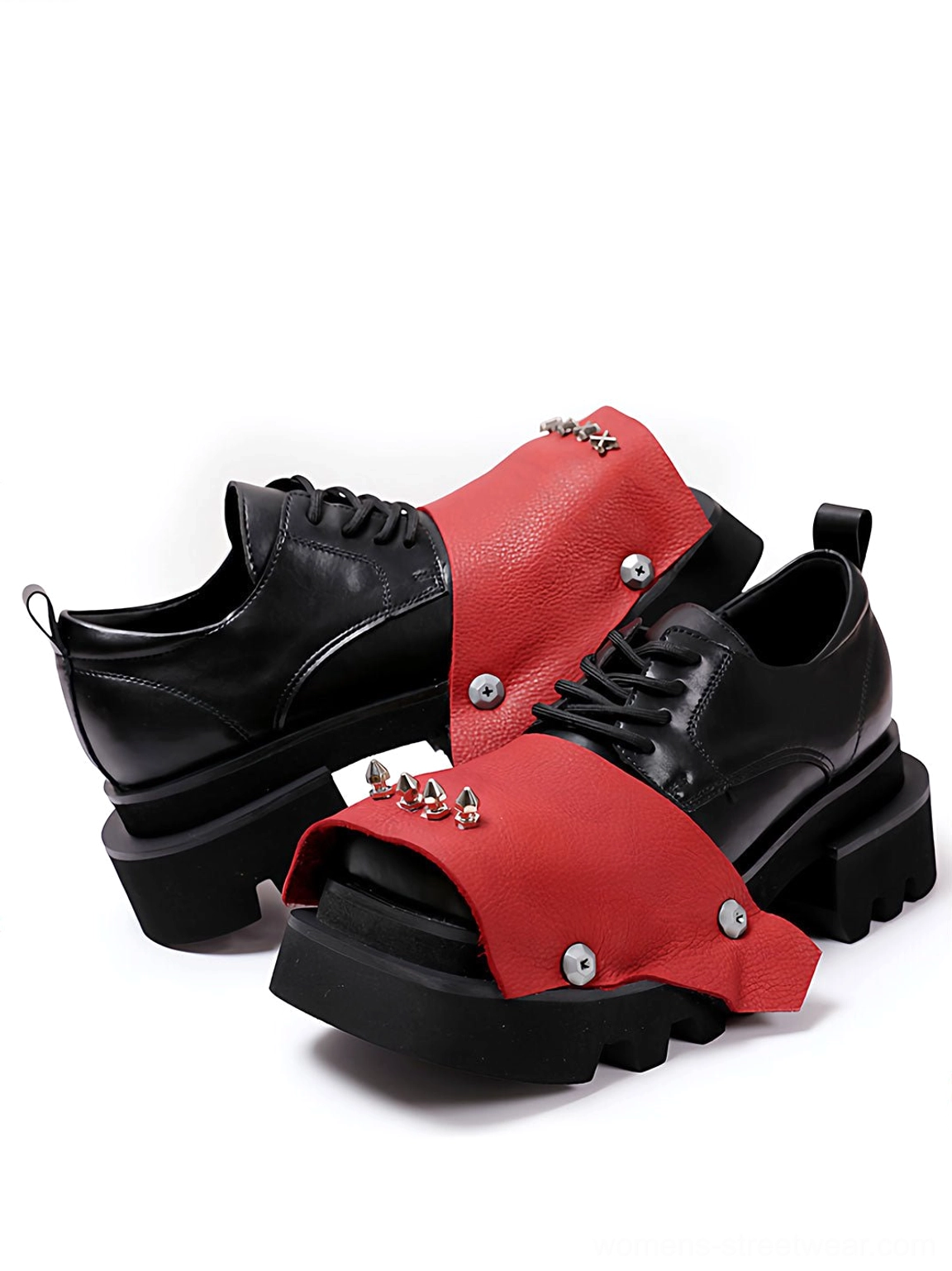 Top oblique view of black and red rivet peep-toe platform derby shoes with metal spike details