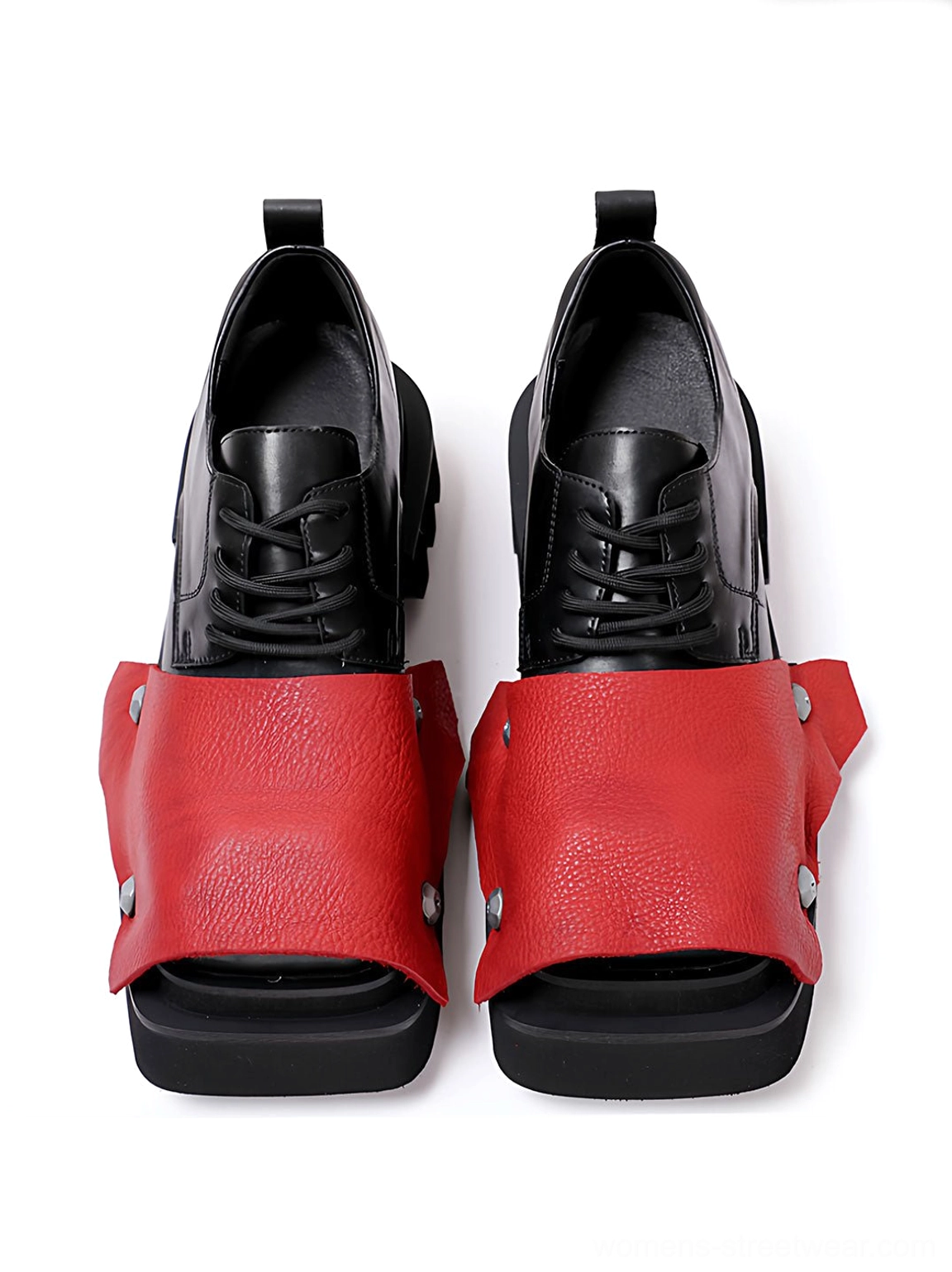 Front view of black lace-up square-toe derby shoes with red peep-toe overlays and silver rivets