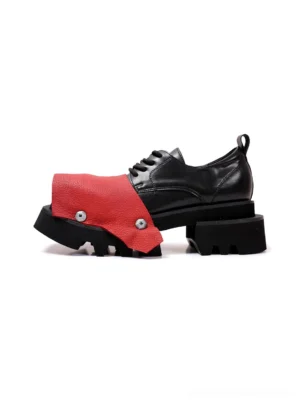 Black and red rivet peep-toe square-toe platform derby shoes in left side three-quarter studio view