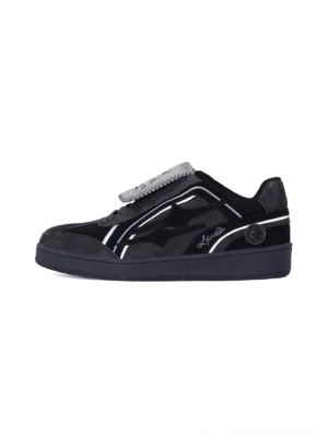 Black reflective piping retro trainer sneaker lateral side view with layered suede-look panels, silver trim, flat rubber sole, and detachable graphic tongue