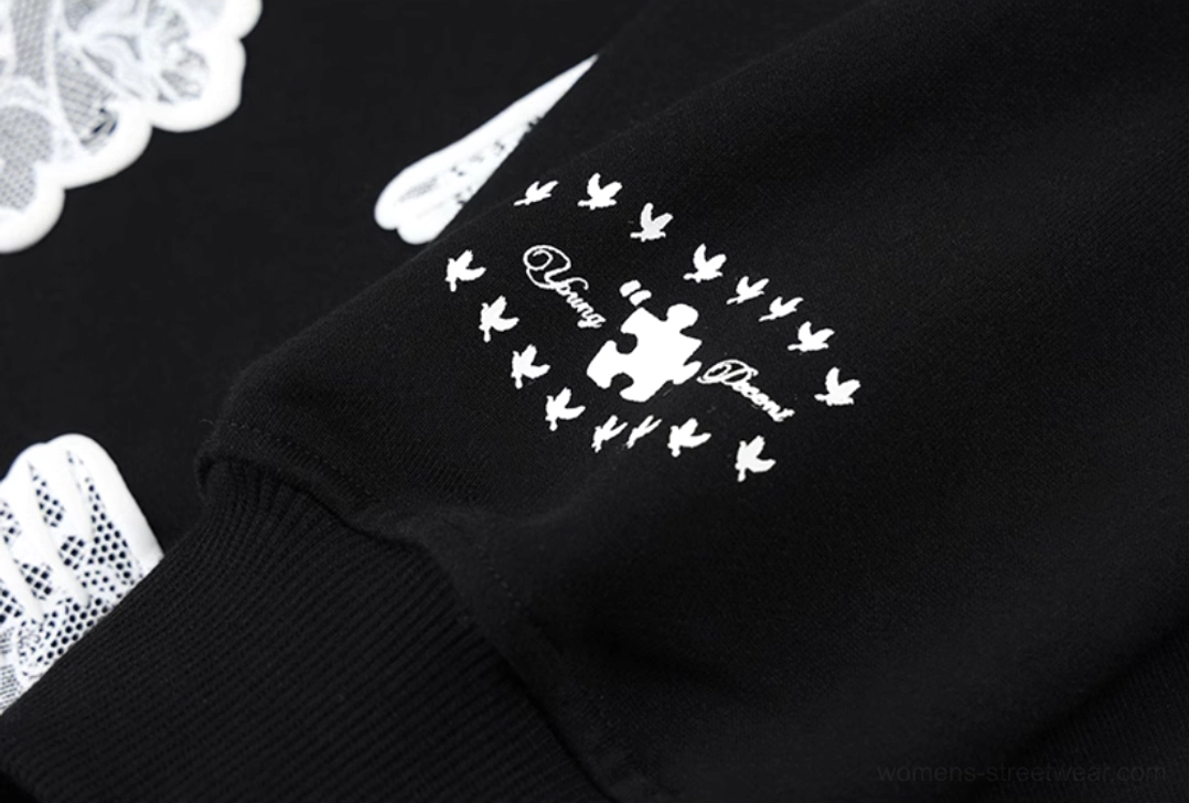 Black relaxed-fit dove appliqué hoodie showcased as a contemporary unisex Y2K streetwear essential
