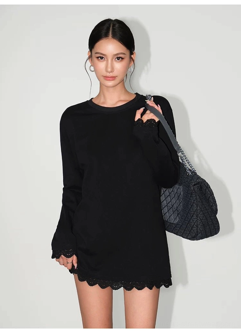 Black relaxed-fit lace-hem long-sleeve tee dress with scalloped hem styling and a quilted black shoulder bag