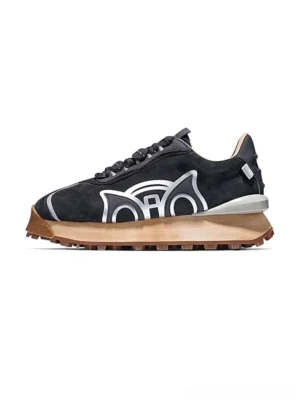 Black retro running sneakers shown in left side profile with layered suede upper silver graphic accent and thick gum brown outsole