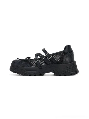 Black rhinestone platform Mary Jane sneakers with mesh upper, double buckle straps, bow detail, and chunky lug sole shown from the side