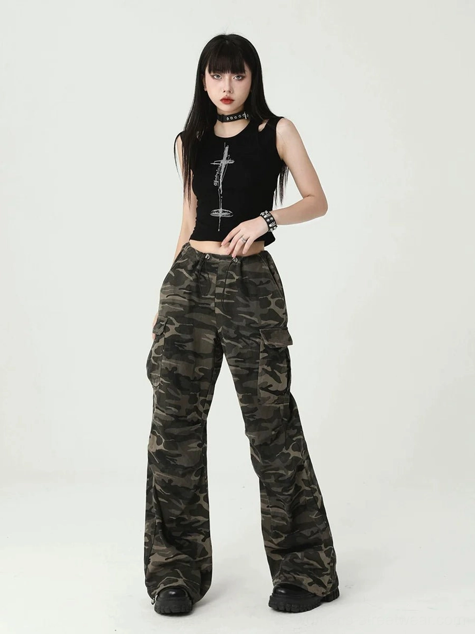 Black ribbed cropped tank top for women featuring a silver cross chest print, cutout shoulders, and modern gothic streetwear design