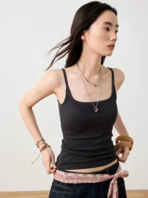 Black ribbed double-strap cami top shown in a three-quarter side view with slim fit, square neckline, delicate spaghetti straps, and textured knit fabric
