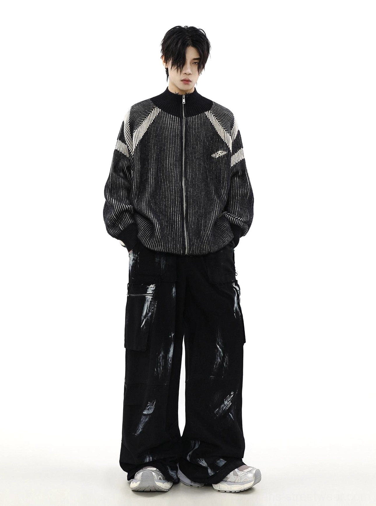 Relaxed black ribbed knit zip cardigan with stand collar, subtle chest logo, and contemporary Korean streetwear styling
