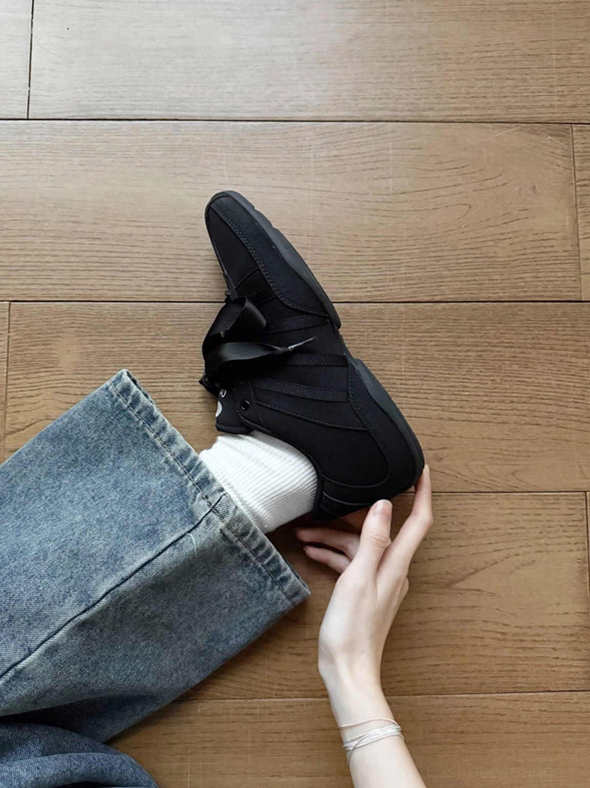 Black ribbon lace minimalist sneakers displayed in a detailed fashion product view for Y2K Korean streetwear styling