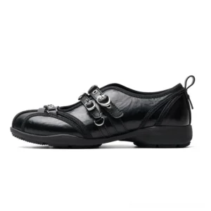 Black rivet harness buckle strap Mary Jane streetwear flats in left side profile with silver buckles and rear pull tab