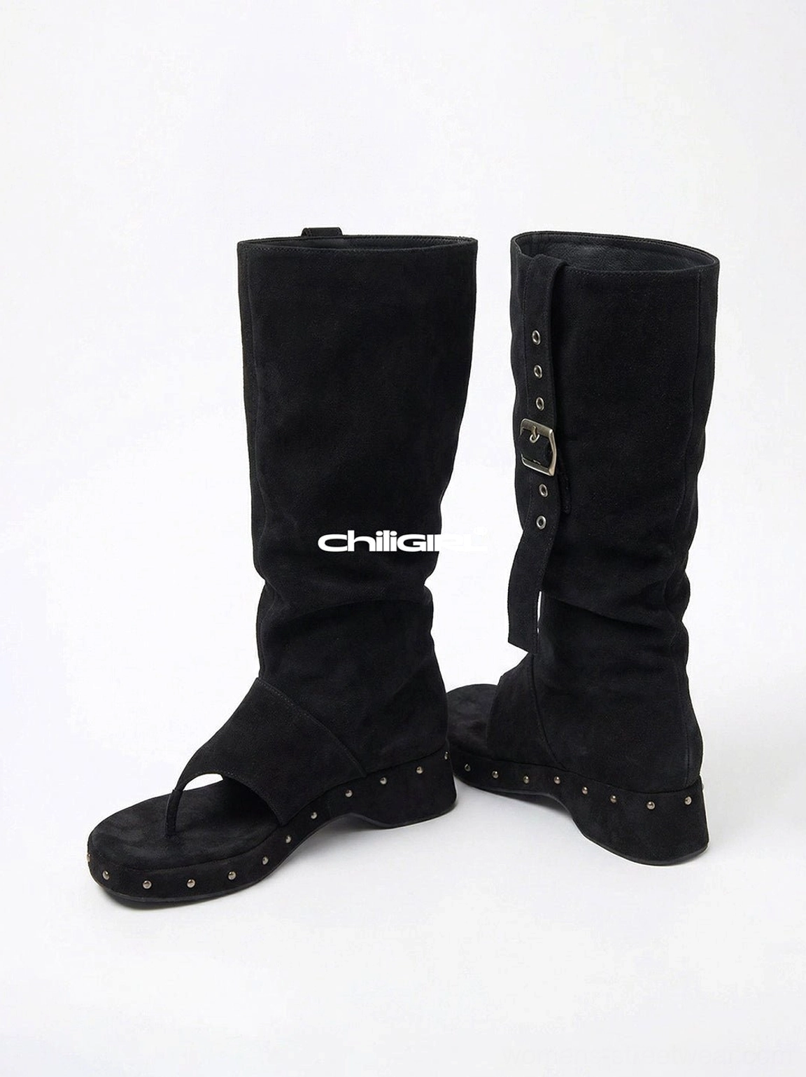 Black rivet thong low-wedge mid-calf sandal boots with open toe buckle strap and slouchy microfiber shaft